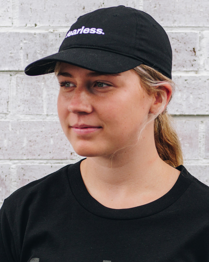 Side view of model wearing  Fearless davie cap in black