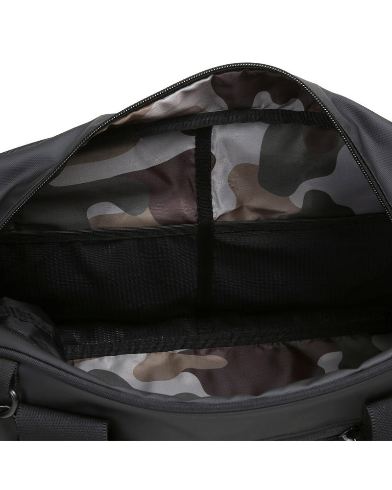 top view of opened matte black burner gym duffel bag showing camo lining