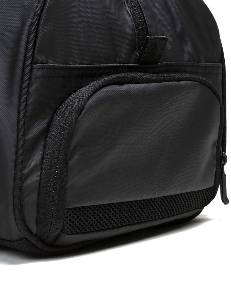 Side view of matte black burner gym duffel bag showing zip shoe compartment