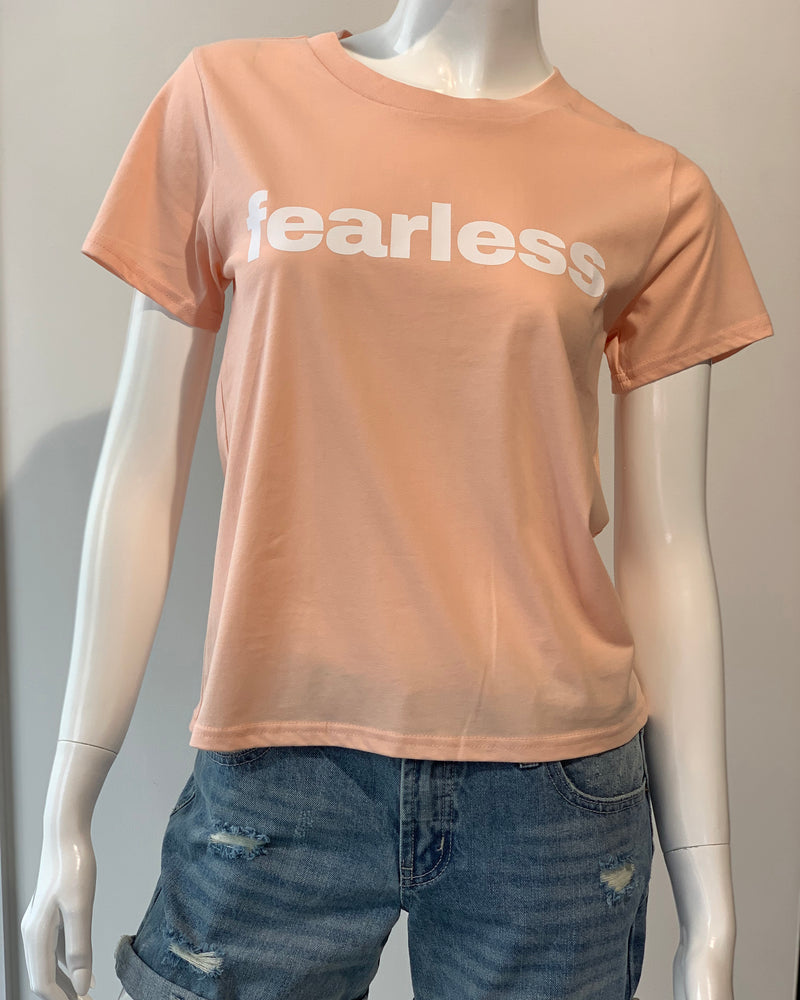 Front view of image of pale pink  Fearless tee on mannequin