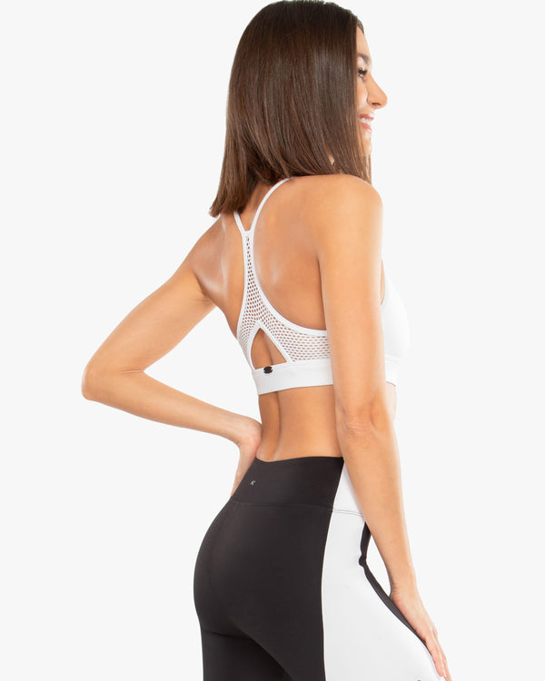 Side View of Model Wearing Slate Blackout Sports Bra