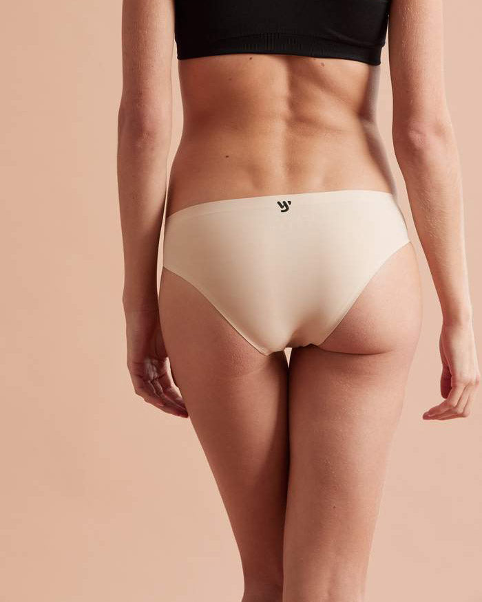 Rear view of model wearing nude bikini brief