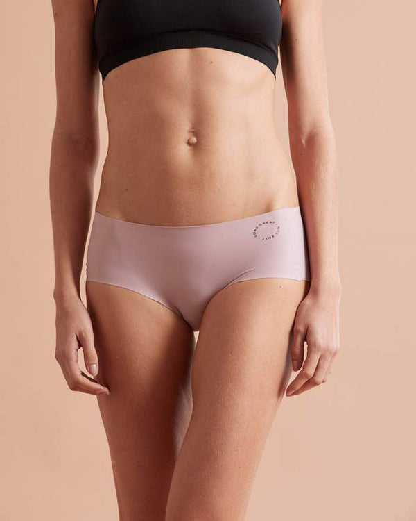 Front view of model wearing dusky pink buddhi brief