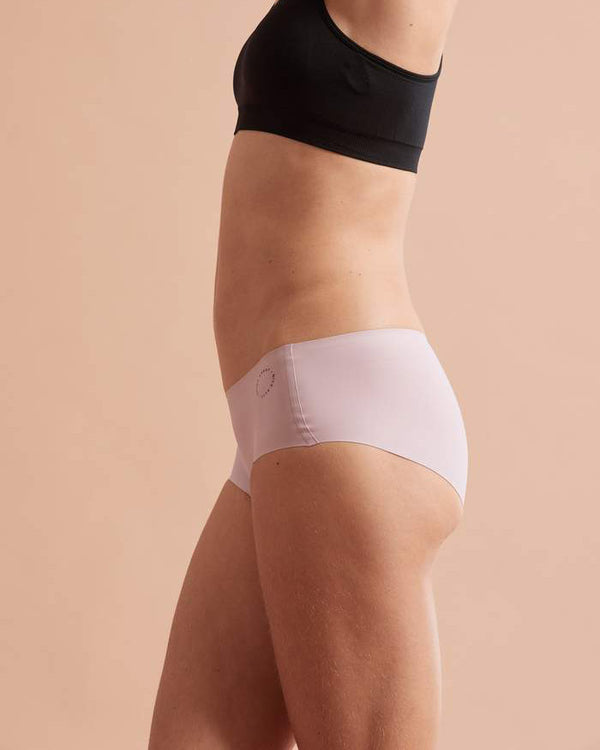 Side view of model wearing dusky pink buddhi brief