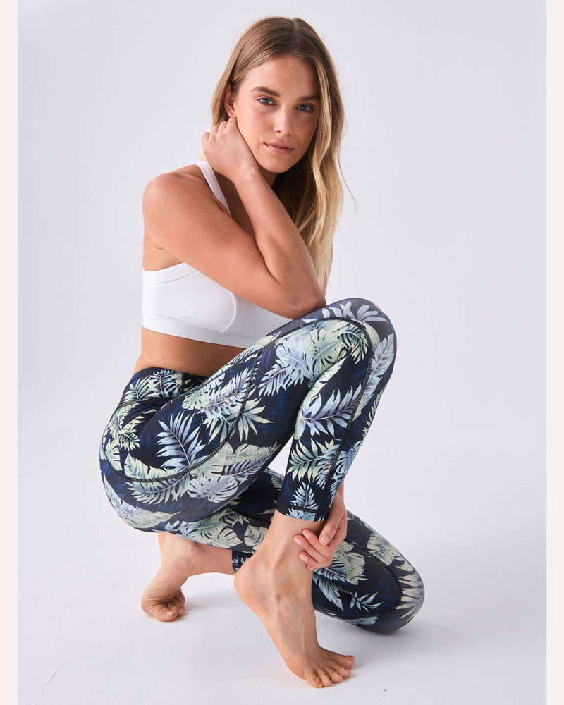 dharma-bums-airbrush-motion-7_8-legging-midnight-tropics-model-crouched