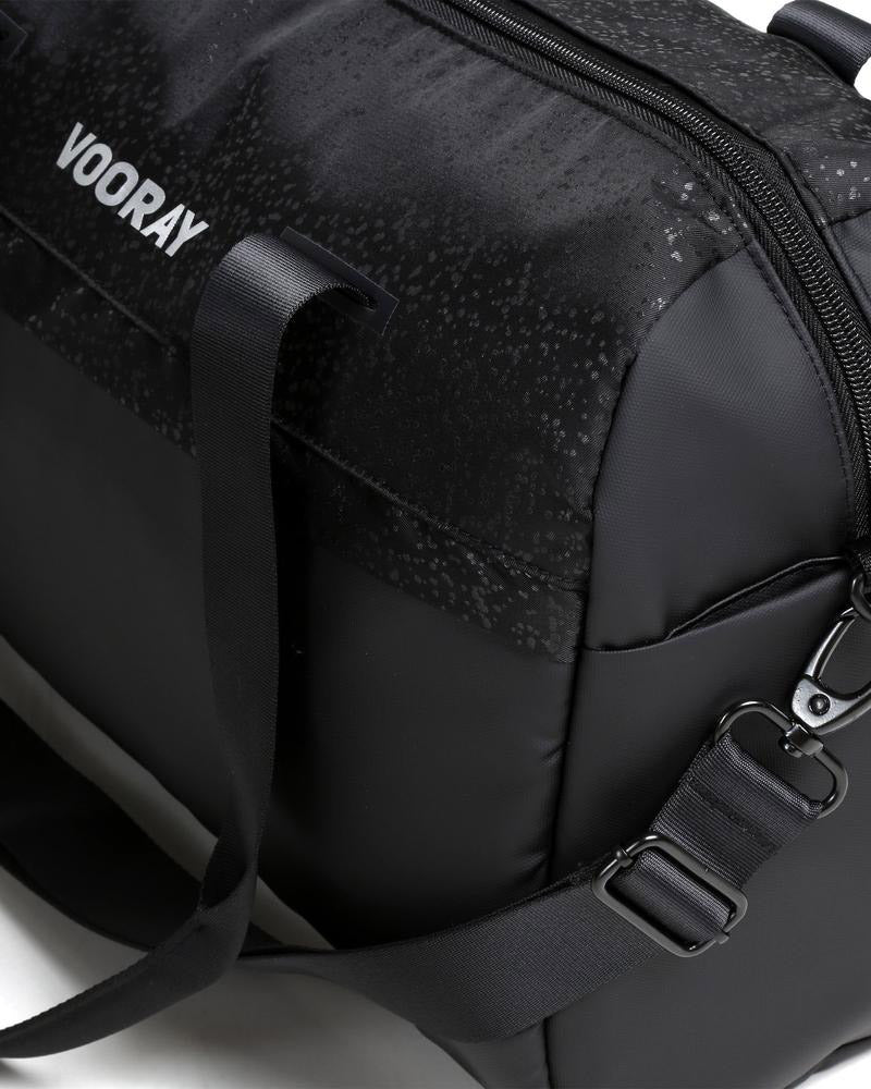 Side view of black foil trainer duffel bag